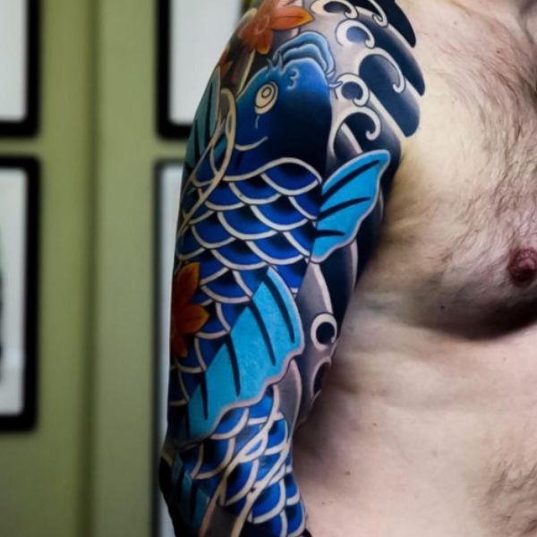 Tattoo chú cá chép hóa thành rồng bên trên bắp tay