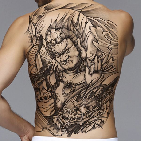 Tattoo kín lưng quỷ và rồng