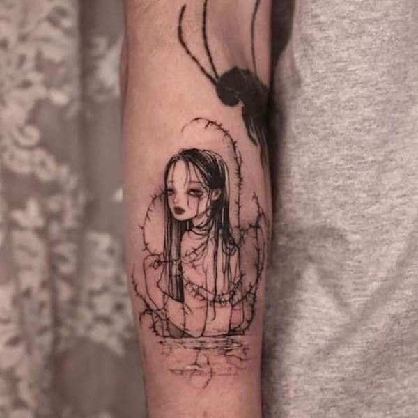 Tattoo cô gái buồn và rặng gai