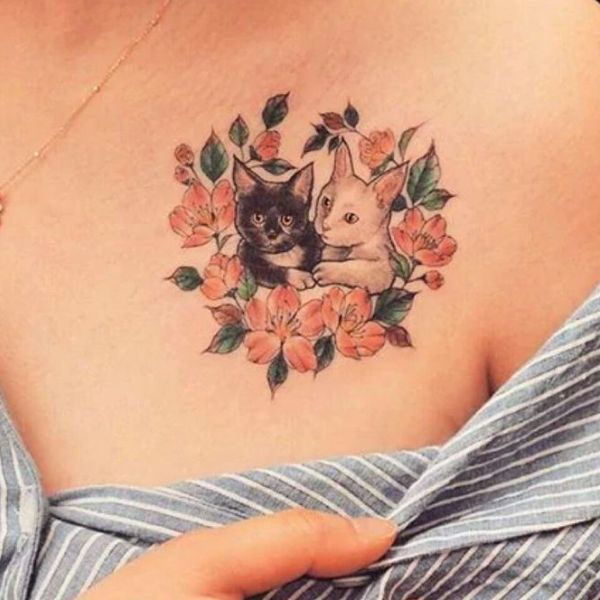 Tattoo con mèo ở ngực nữ
