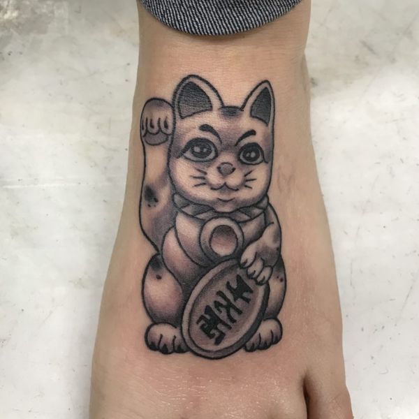 tattoo con cái mèo thần tài