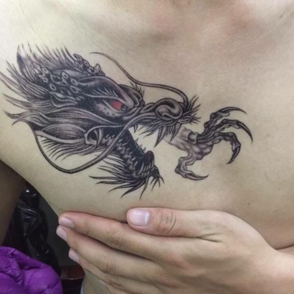 Tattoo đầu rồng một bên ngực