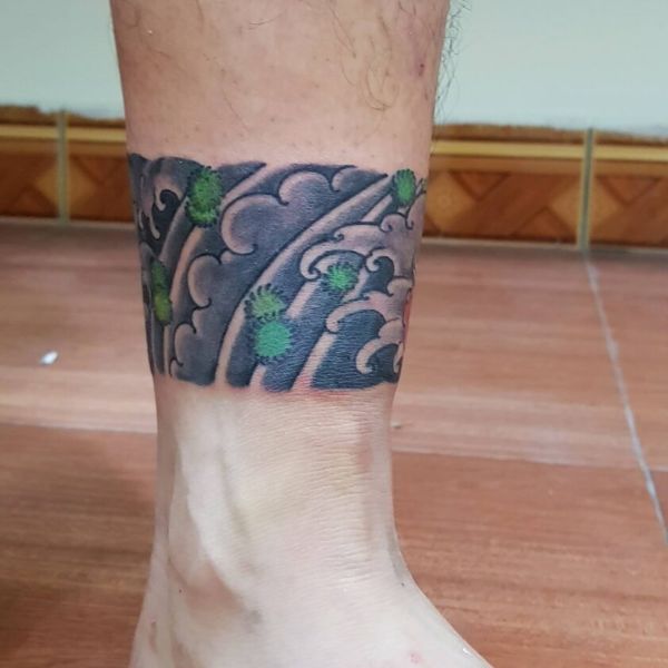 Tattoo vòng chân daruma