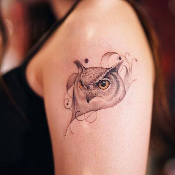 Tattoo cú mèo ở bắp tay