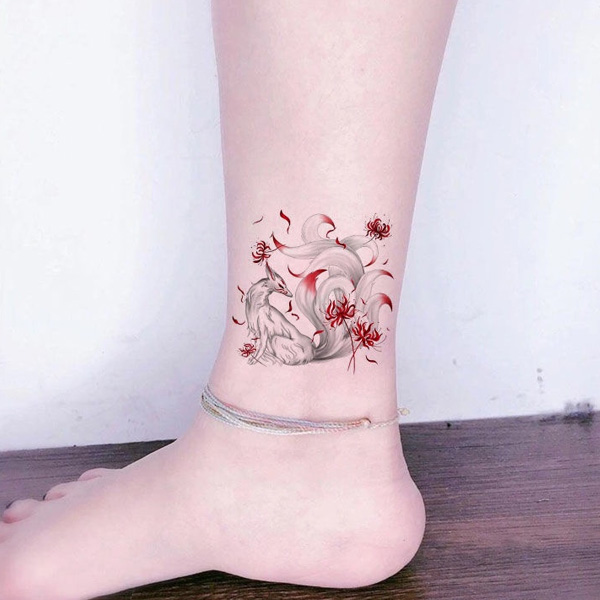 Tattoo hồ ly 9 đuôi hoa bỉ ngạn
