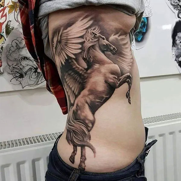 Tattoo con cái ngựa với cánh ở bụng đẹp