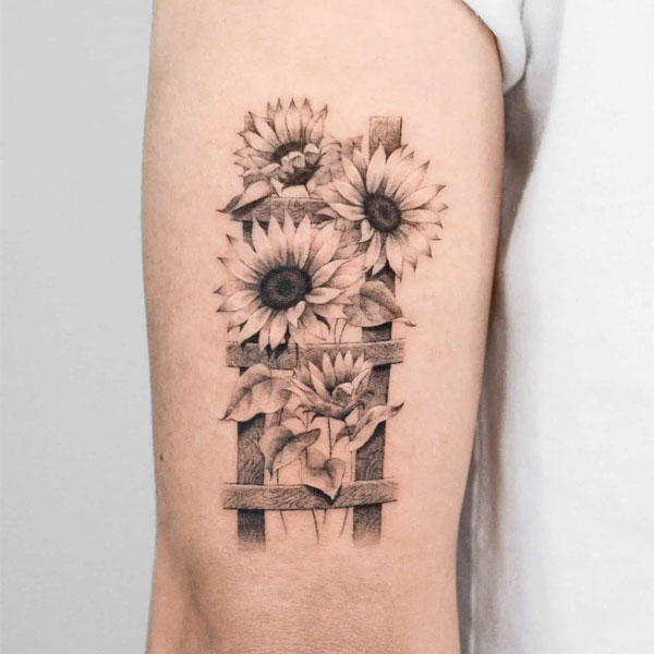 Tattoo mệnh hoa hoa hướng dương bắp tay