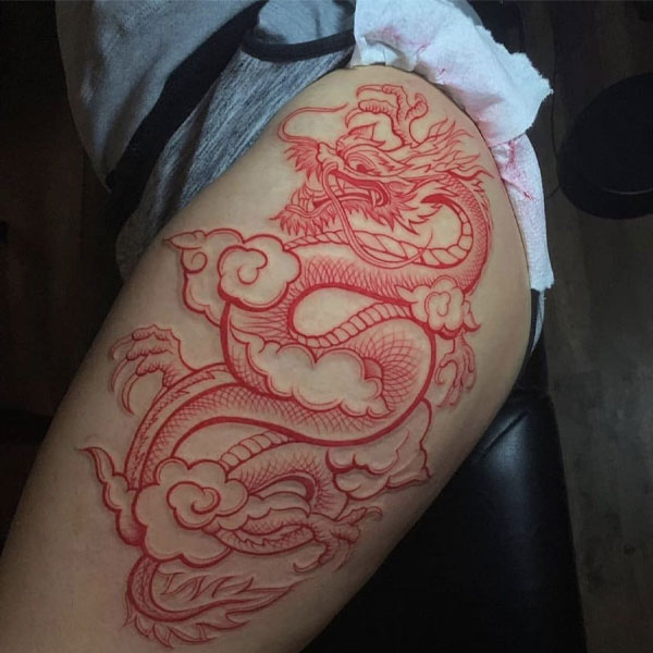 Tattoo mệnh hỏa rồng đỏ ở đùi